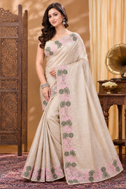 Beige Tussar silk cutwork saree front view with pink and olive green embroidery