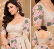 Close-up of embroidered blouse sleeves and floral cutwork details